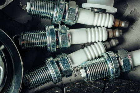 Car spark plugs on black background close upの写真素材
