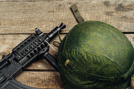 US military helmet on wooden background close upの写真素材