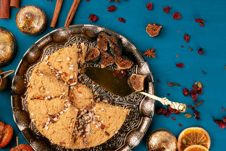 Top view of assortment of turkish baklava on traditional plate on dark backgroundの写真素材