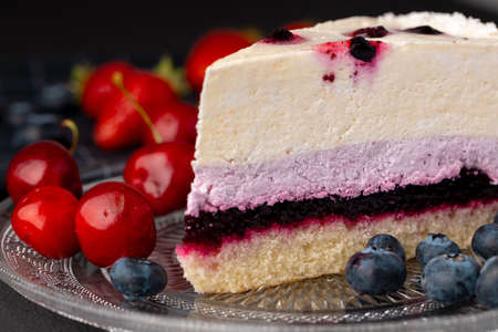 Soft berry souffle cake decorated with fresh berries close upの写真素材