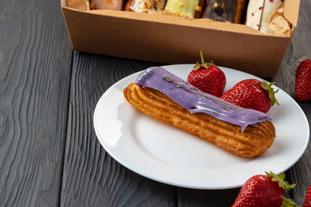 Close up of fresh french eclair cake with icing, copy space