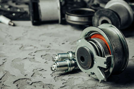 Car parts on grey textured concrete backgroundの写真素材