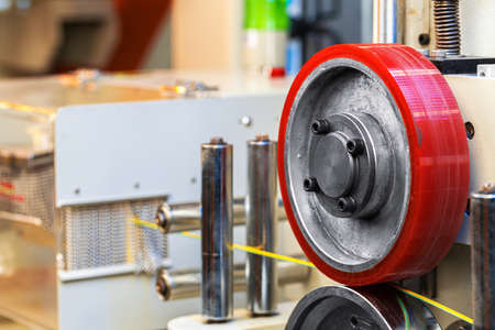 Cable production. Close up of a cable reel, manufacturing zone