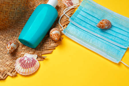 Sunscreen cream and protective mask. Coronavirus summer concept