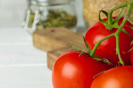 Close up of ripe fresh cherry tomatoes on kitchen tableの写真素材