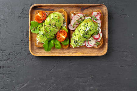 Toasted avocado sandwich for breakfast, top view. Vegan foodの写真素材