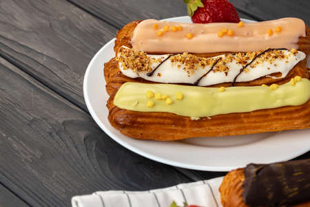 Close up photo of fresh french eclair cake with icing, copy spaceの写真素材