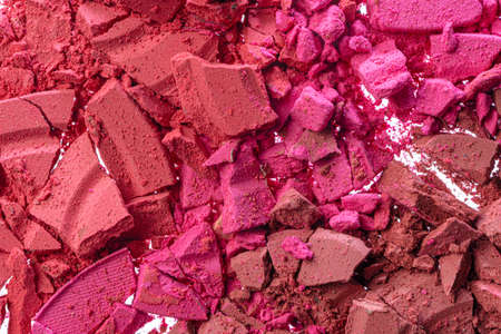 Background of smashed pink blush cosmetic powder
