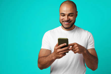 Young african american man making video call with his smartphone