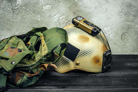US military helmet on wooden background close up