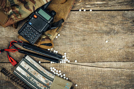 Close up photo of airsoft gun magazine and airsoft balls on wooden backgroundの写真素材