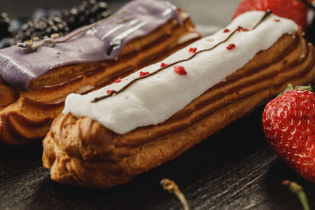 Eclair cake decorated with berries close up