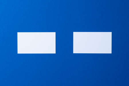 Blank paper business mock up on classic blue backgroundの写真素材
