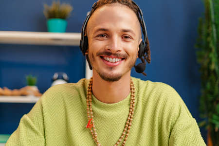 Portrait of a young guy with headset, customer service worker