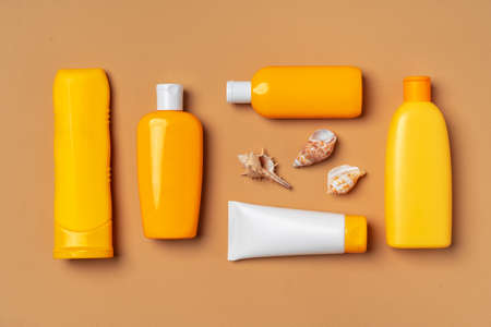 Assortment of sunblock creams on beige backgroundの写真素材