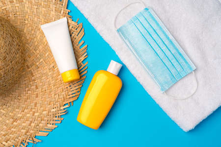 Sunscreen cream and protective mask. Coronavirus summer concept