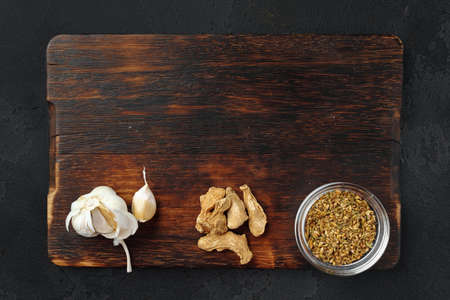Spices on dark wooden background, view from aboveの写真素材