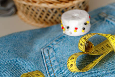 Pillow for pins and measuring tape close up