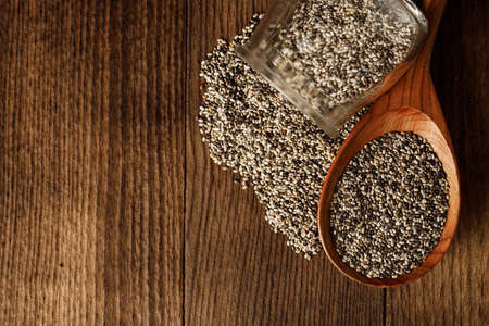 Wooden spoon with chia seeds close upの写真素材
