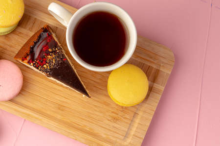 Piece of cheesecake with chocolate top and berriesの写真素材