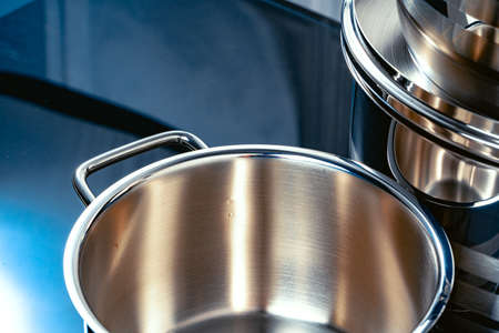 Set of aluminum pans on black surface close upの写真素材