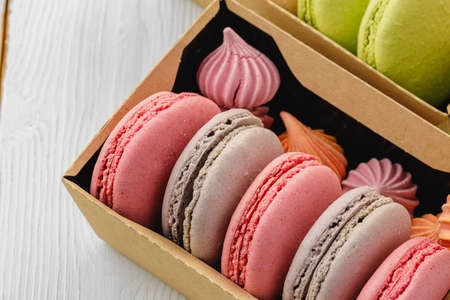 Colorful macaron cookies in a cardboard box