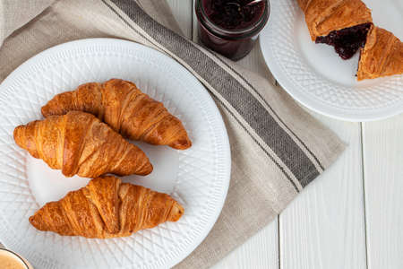 Fresh baked croissant on wooden table close upの写真素材