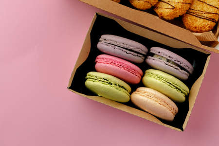 Pile of colorful macaroon cookies on pink backgroundの写真素材