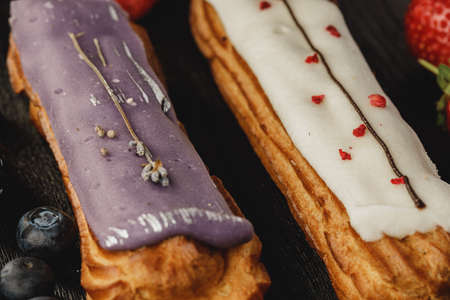 Eclair cake decorated with berries close upの写真素材