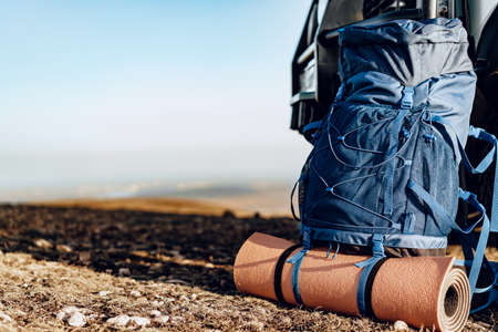 Hikers backpack left on the top of the mountain