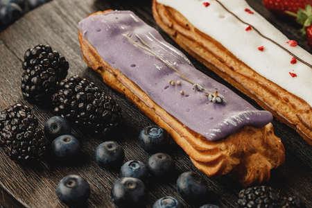Eclair cake decorated with berries close upの写真素材