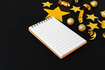 Blank sheet of paper with golden decorative stars. New year resolutions conceptの写真素材