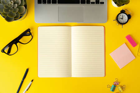 Open laptop with blank notebook, view from above. Workplace conceptの写真素材