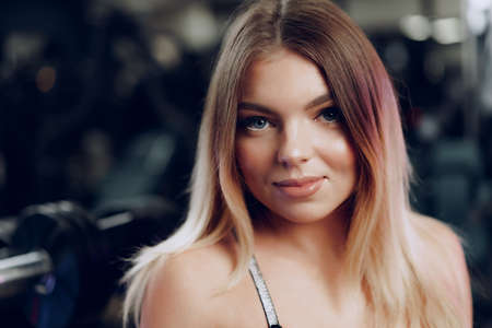 Portrait of a fit young blonde woman in black sport braの写真素材