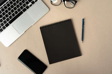 Open laptop with blank notebook, view from above. Workplace conceptの写真素材