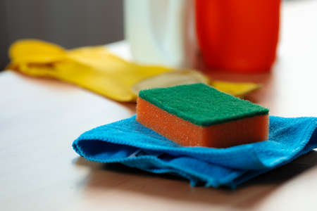 Cleaning sponge and rag on kitchen counterの写真素材