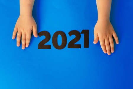 Concept of the year 2021. 2021 numbers on paper background, view from above
