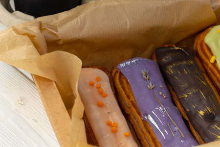 Group of colorful eclair cakes close up