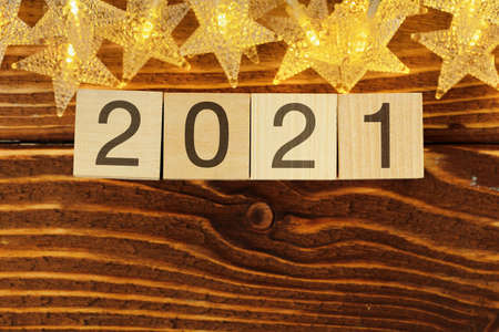 Concept of the year 2021. Golden stars with 2021 numbers on paper backgroundの写真素材