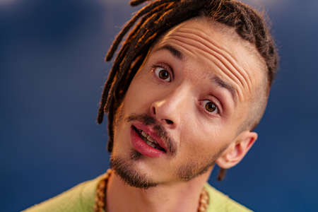 Portrait of a happy positive guy with dreadlocks