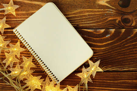 Blank sheet of paper with golden decorative stars. New year resolutions conceptの写真素材