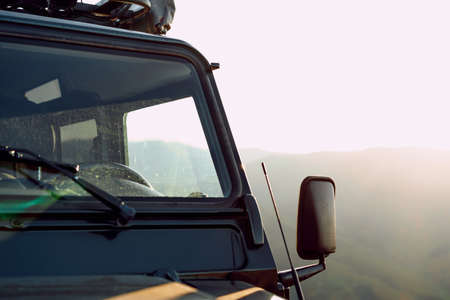 Dark green off-road car in the mountains
