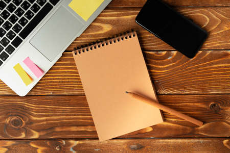 Open laptop with blank notebook, view from above. Workplace concept