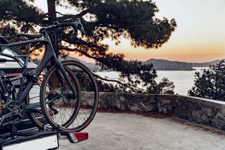 Crossover car with two road bicycles loaded on a rack