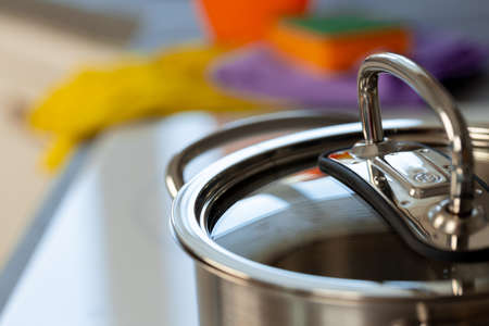 Close up photo of a aluminum cover of a casserole
