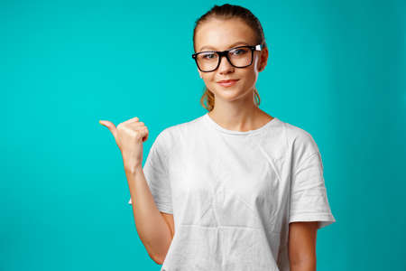 Portrait charming pretty cheerful girl showing copy space