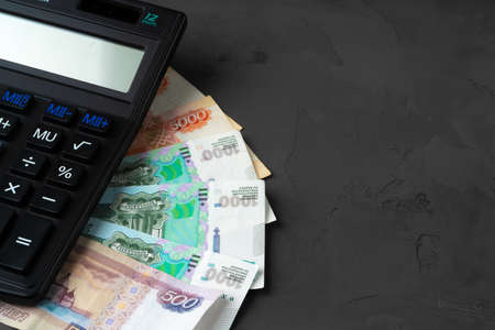Close up photo of stack of Russian money rubles with calculatorの写真素材