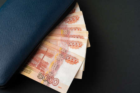 Blue wallet full of money Russian Ruble