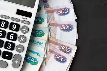 Close up photo of stack of Russian money rubles with calculatorの写真素材