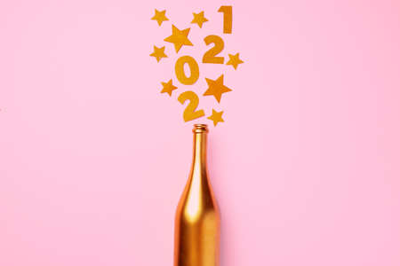 Champagne bottle with confetti flat lay top viewの写真素材